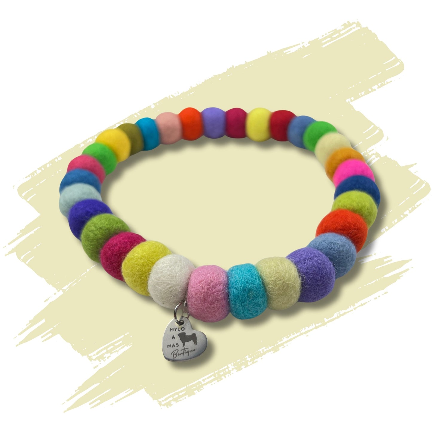 Colourful dog pom pom necklace made of wool felt balls of all colours.